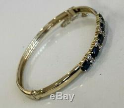9ct solid gold with Sapphire & white stone bangle 8.30g
