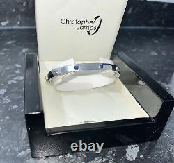 9ct white gold screw bangle with X2 sapphires 19cm