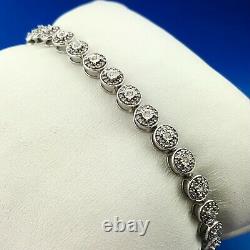 Elegant 10K White Gold Diamond Station Pinwheel Panel Tennis Bracelet
